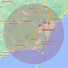 A map with a shaded circle area indicating the service area for Comfort Science Solutions. It covers the coast from Little River to Hampstead, and inland to Westbrook.