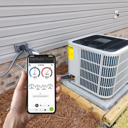 A technician is using a mobile phone with the MeasureQuick app displayed. He is holding in front of an outdoor AC unit. Caption: Air Conditioning and Heating Service and Repair