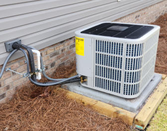 A newly installed air conditioning compressor unit