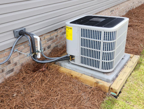 A newly installed air conditioning compressor unit